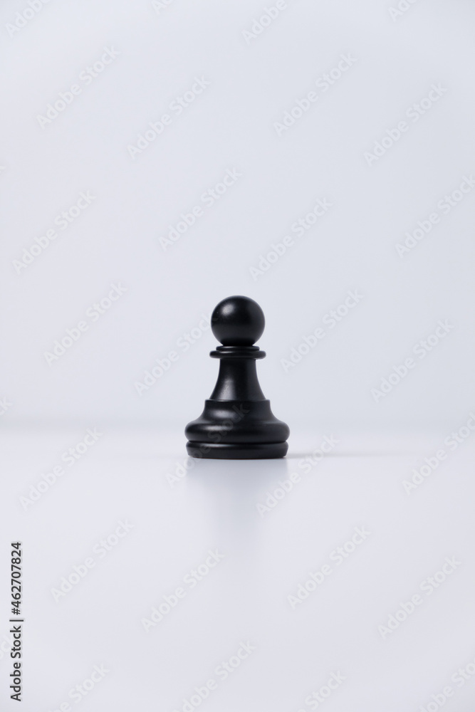 isolated black pawn chess piece on white background
isolated black pawn chess piece on white background