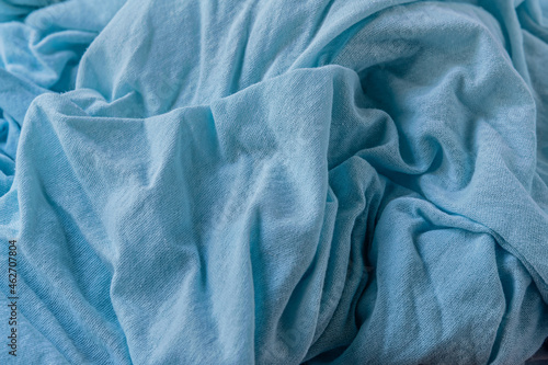 abstract background of old light blue knit fabric texture close up