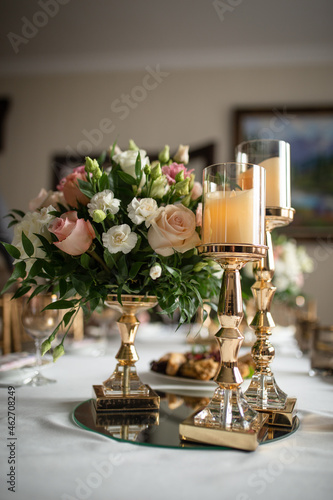 festive decoration of the event . flowers and beautiful candlesticks on the table