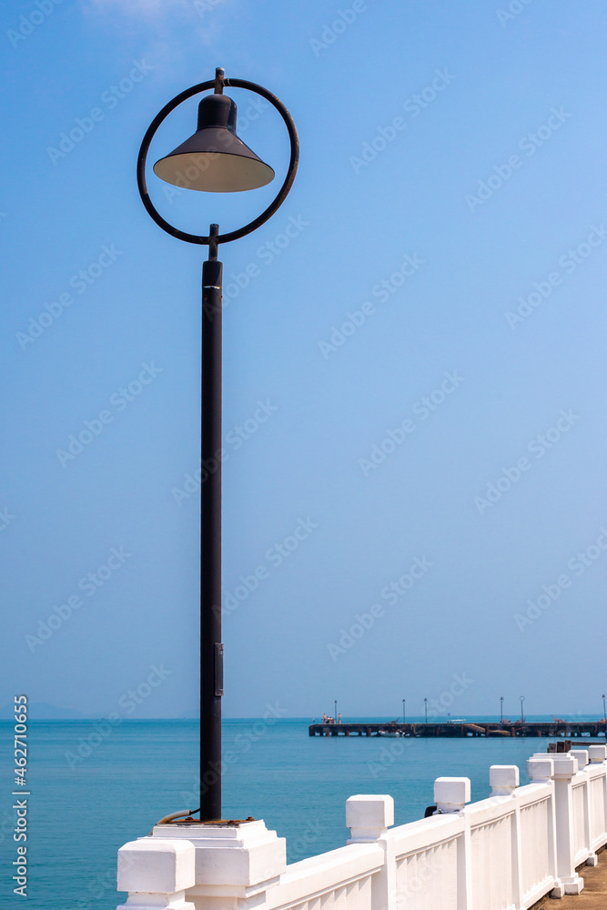 Lantern on a sea pier in Thailand. Travel and tourism.