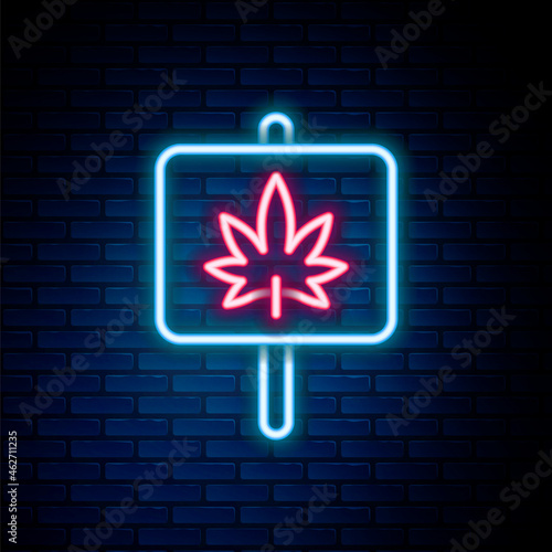 Glowing neon line Medical marijuana or cannabis leaf icon isolated on brick wall background. Hemp symbol. Colorful outline concept. Vector