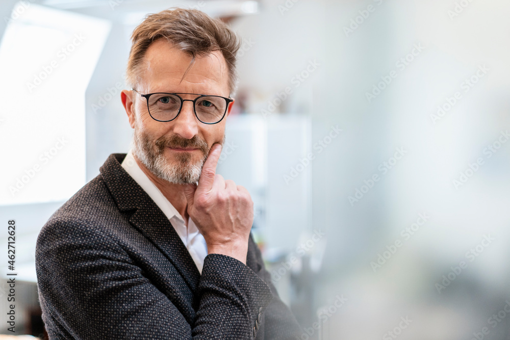 Portrait of confident businessman in office Portrait of confident businessman in office
