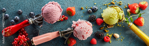 Assorted ice cream on scoop and fresh fruits photo