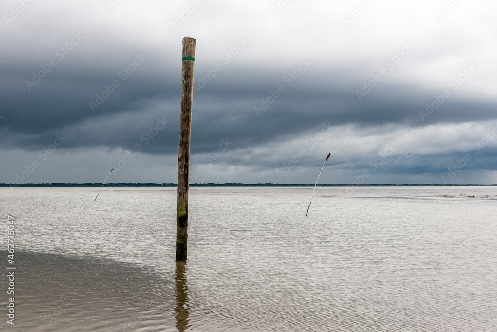 Germany, Nessmersiel, wooden stake in the sea Germany, Nessmersiel, wooden stake in the sea