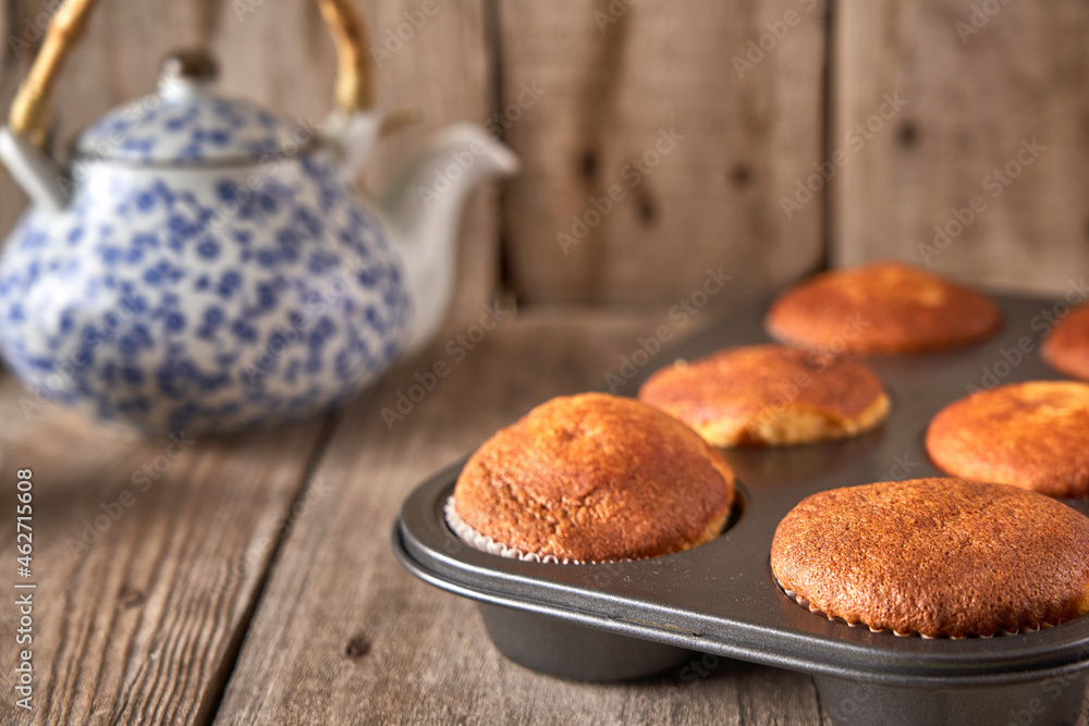 Tray with baked muffins Tray with baked muffins