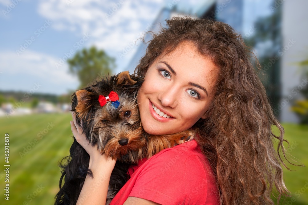 Teenage girl with her cute dog in park Teenage girl with her cute dog in park