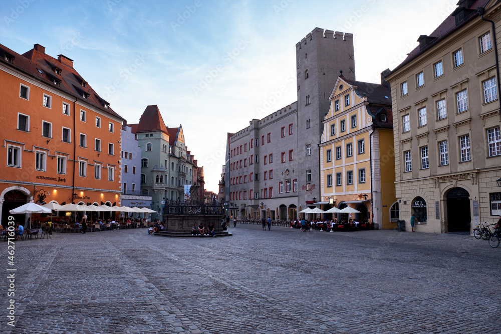 Town square amidst buildings against sky in city, Regensburg, Germany Town square amidst buildings against sky in city, Regensburg, Germany