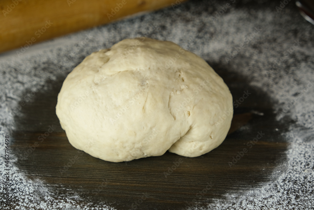 sourdough is ready for rolling and baking. close-up. the process of making homemade bread or pizza. crop photo portions of yeast dough. sourdough is ready for rolling and baking. close-up. the process of making homemade bread or pizza. crop photo portions of yeast dough.