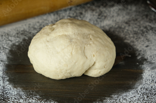 sourdough is ready for rolling and baking. close-up. the process of making homemade bread or pizza. crop photo portions of yeast dough.