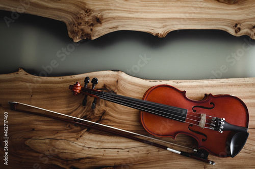 Violin and bow on wood photo