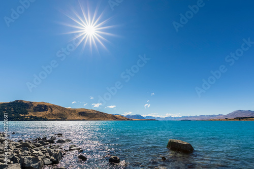New Zealand, Oceania, South Island, Canterbury, Lake Tekapo, Rocks on lakeshore photo