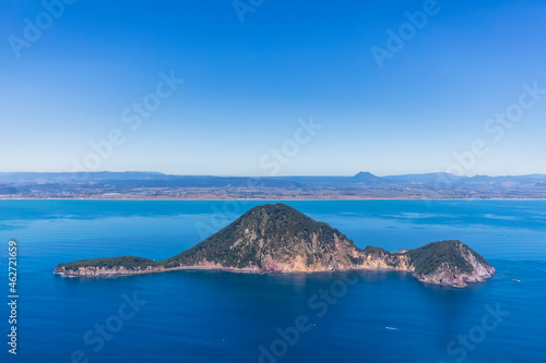 New Zealand, North Island, Whakatane, Aerial view of White IslandÔøΩ(Whakaari) surrounded by blue waters of Pacific Ocean photo