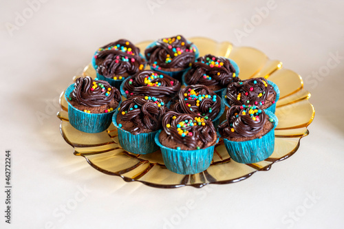 Chocolate cupcakes on a glass plate