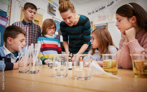 Children in a science lesson with a teacher photo