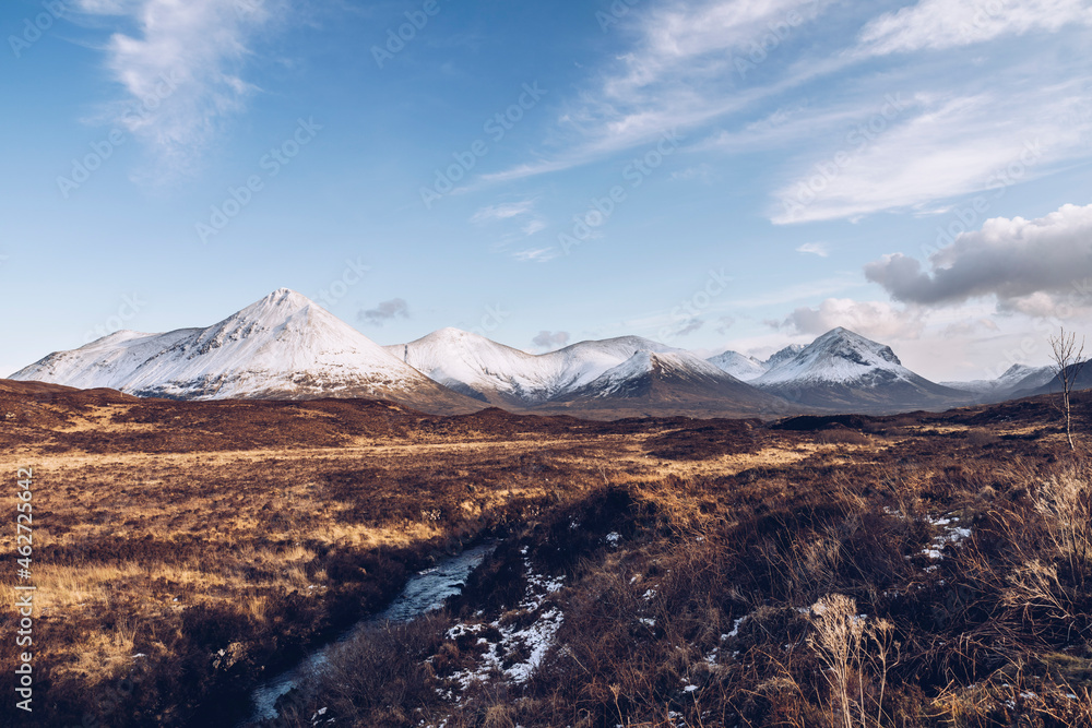 UK, Scotland, River flowing on Isle of Skye in winter with snowcapped mountains in background UK, Scotland, River flowing on Isle of Skye in winter with snowcapped mountains in background