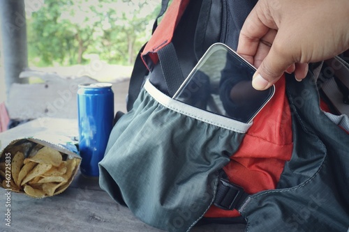 Potato chips in the bag wiht cola and bag photo