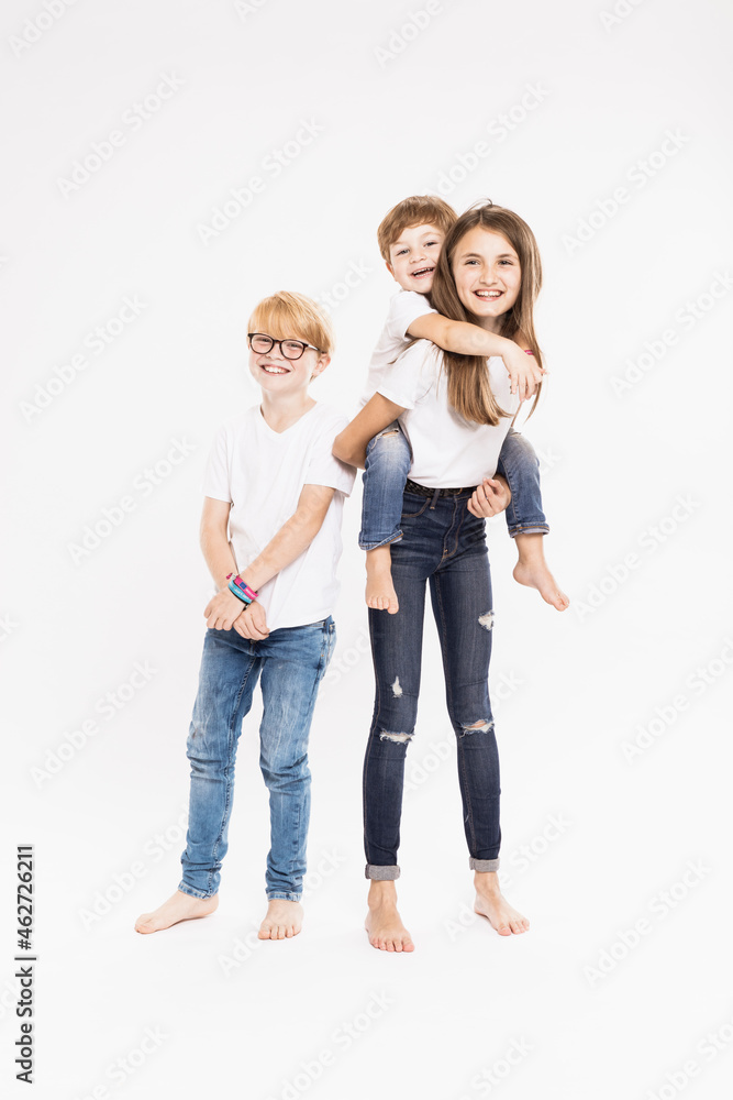 Cheerful siblings in casuals against white background Cheerful siblings in casuals against white background