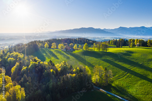 Germany, Bavaria, Buchberg, Drone view of green countryside landscape at foggy springtime sunrise photo