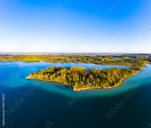 Germany, Bavaria, Inning am Ammersee, Drone view of clear sky over forested shore of Worth island photo