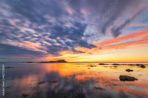 Tranquil view of Yellowcraigs Beach against cloudy sky, East Lothian, Scotland during sunset photo