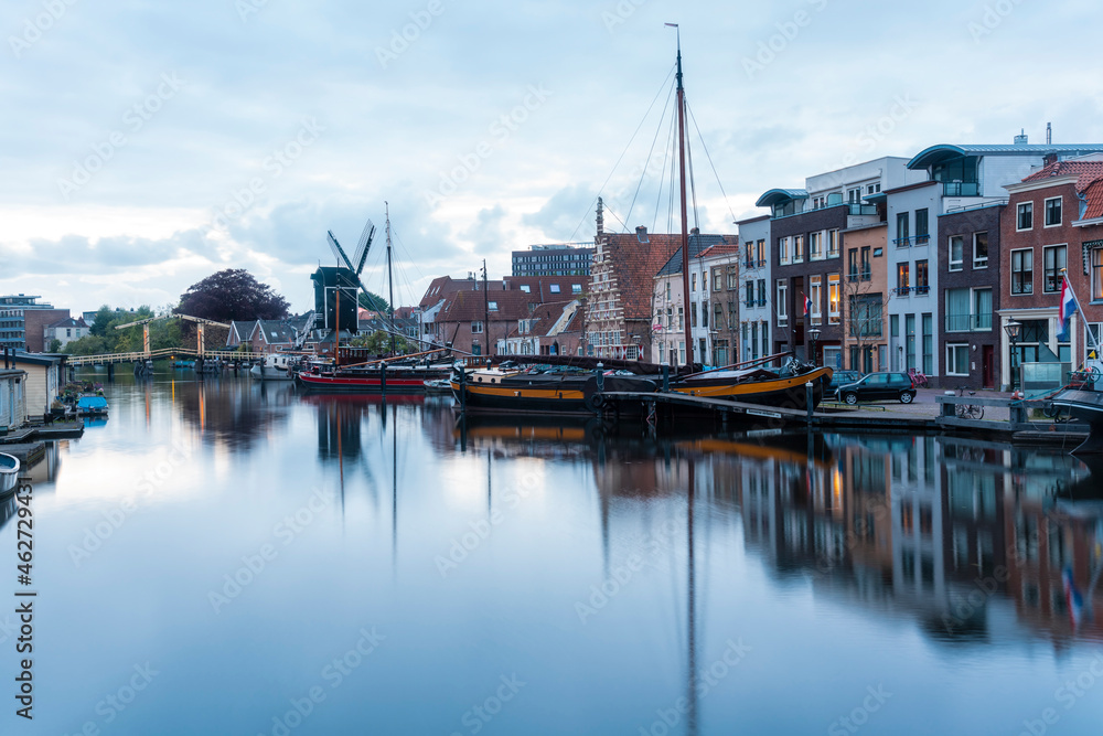 Netherlands, South Holland, Leiden, Sailboat moored in old harbor by Galgewater Netherlands, South Holland, Leiden, Sailboat moored in old harbor by Galgewater