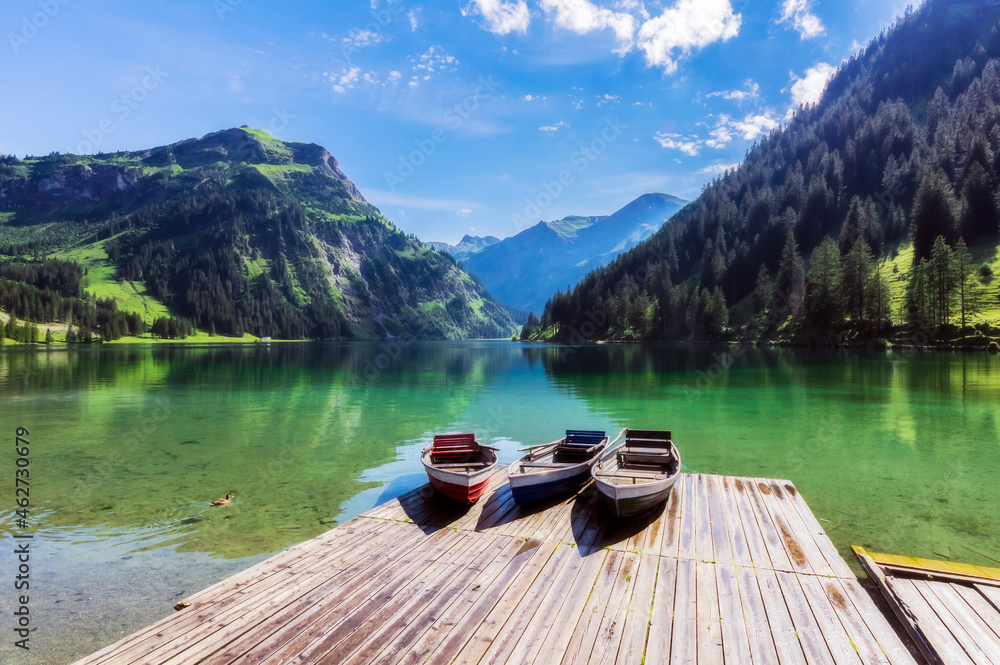 Motorboats left on lakeshore jetty in Tannheimer Tal Motorboats left on lakeshore jetty in Tannheimer Tal