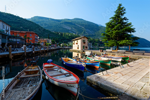 Italy, Trentino, Torbole, Lake Garda, Boats moored in harbor photo
