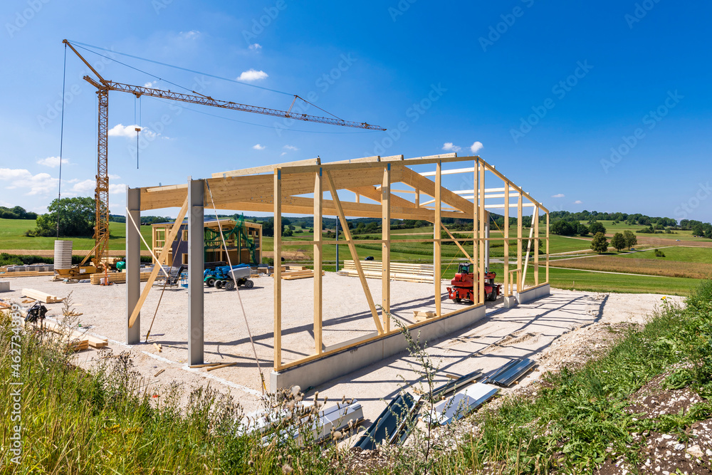 Germany, Baden-Wurttemberg, Wooden frame of new building under construction Germany, Baden-Wurttemberg, Wooden frame of new building under construction