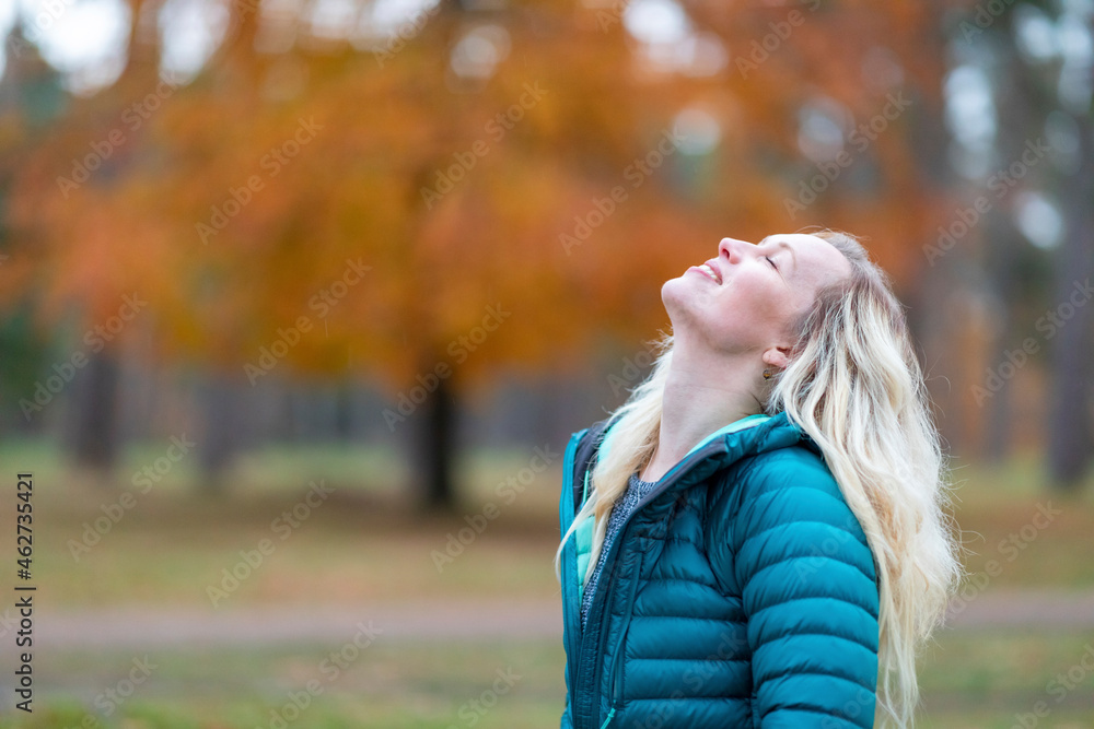 Carefree woman with eyes closed standing at Cannock Chase Carefree woman with eyes closed standing at Cannock Chase