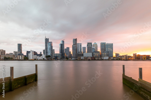 Wallpaper Mural Modern skyline by Thames River in city against cloudy sky during sunset, London, UK Torontodigital.ca