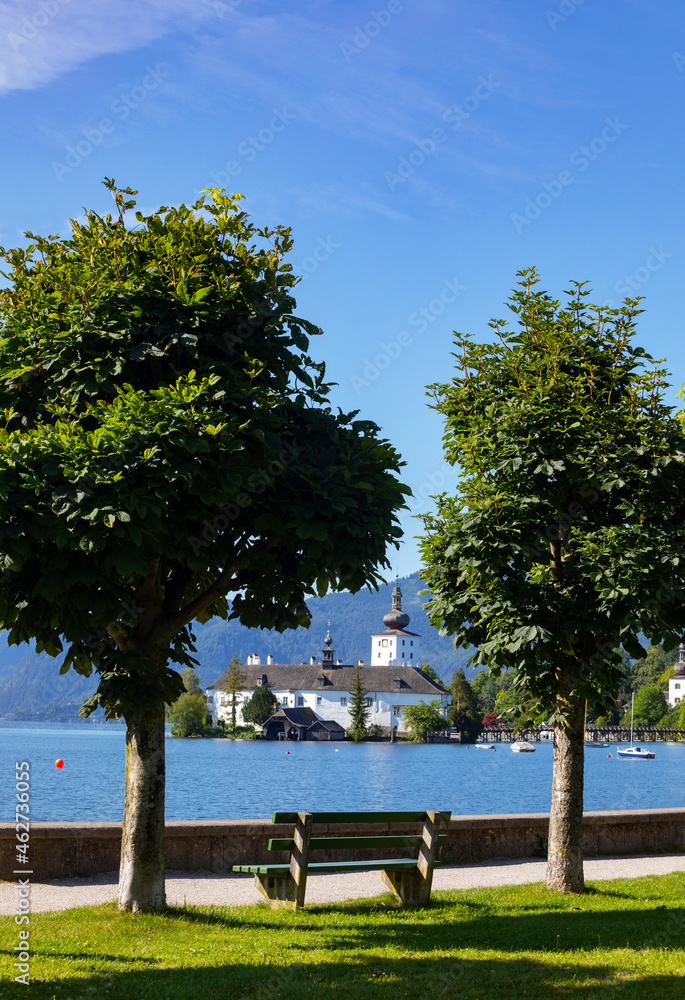 Schloss Ort seen through trees on esplanade against sky, Gmunden, Salzkammergut, Upper Austria, Austria Schloss Ort seen through trees on esplanade against sky, Gmunden, Salzkammergut, Upper Austria, Austria