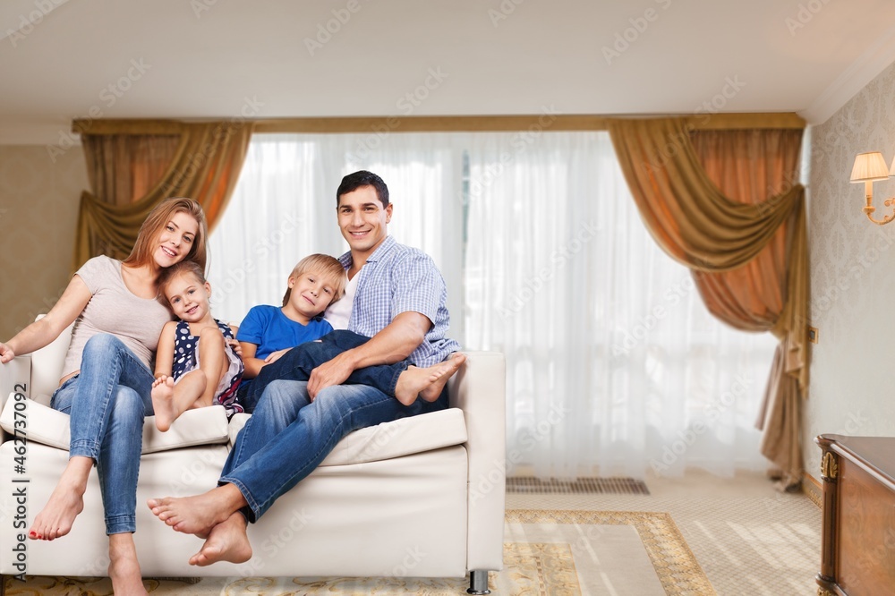 Cheerful happy young Family having Fun Together At Home Cheerful happy young Family having Fun Together At Home