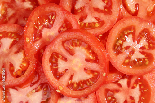 Food background circles slices red tomato close-up photo