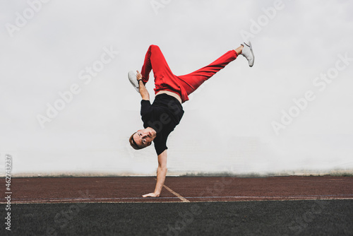 dancing breakdance in the street, acrobatic motion
