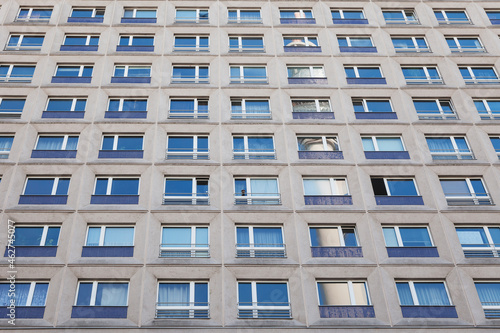 Germany, Berlin-Mitte, part of facade of concrete tower block with reflection of television tower photo