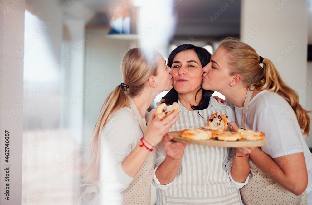 Mother serving her daughters homemade cake Mother serving her daughters homemade cake