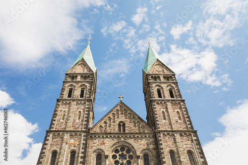 Germany, North Rhine Westfalia, Eifel, Monschauer Land, Monschau region, Kalterherberg, Low angle view of Kalterherberger parish church St. Lambertus, Eifeldom photo