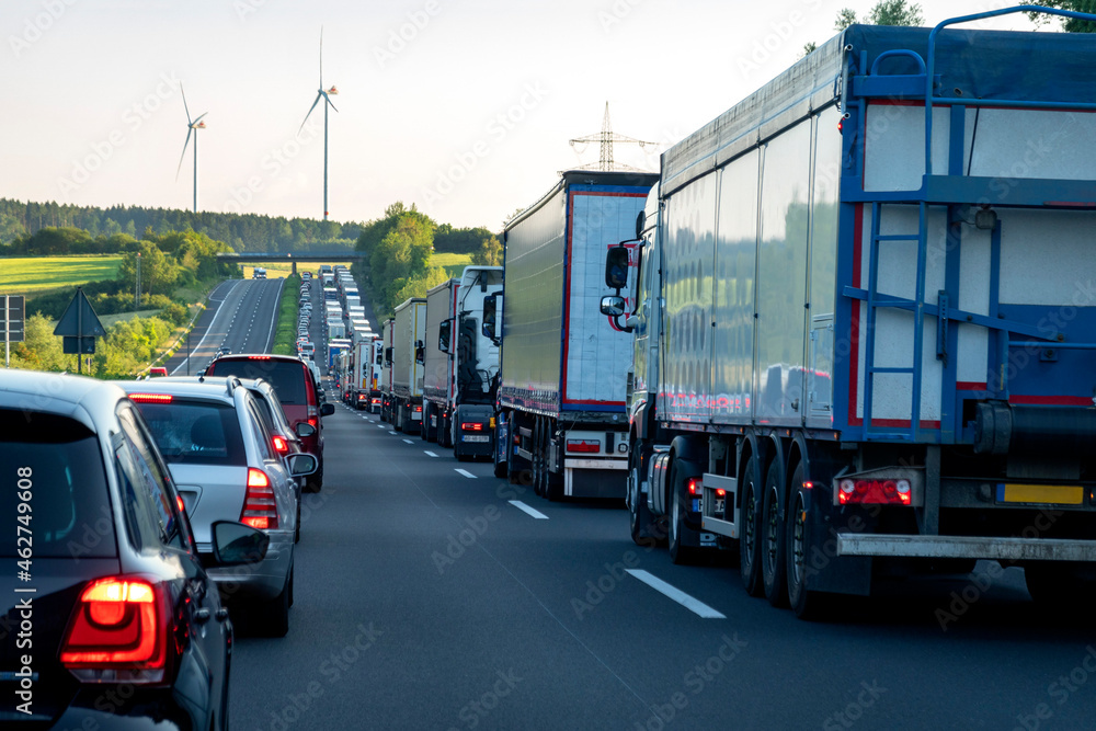 Rescue lane, cars and trucks during traffic jam in the evening, Germany Rescue lane, cars and trucks during traffic jam in the evening, Germany