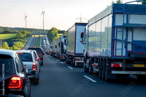Rescue lane, cars and trucks during traffic jam in the evening, Germany photo