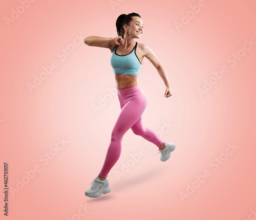 Smiling young fitness model in sportswear doing exercise