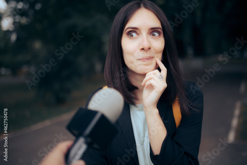 Tv Journalist Interviewing a Woman on the Street photo