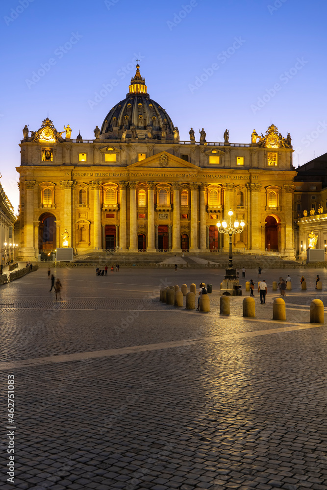 Illuminated facade of St. Peter's Basilica and St. Peter's Square at dusk, Vatican City, Rome, Italy Illuminated facade of St. Peter's Basilica and St. Peter's Square at dusk, Vatican City, Rome, Italy