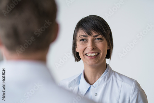 Patient consulting with female doctor photo