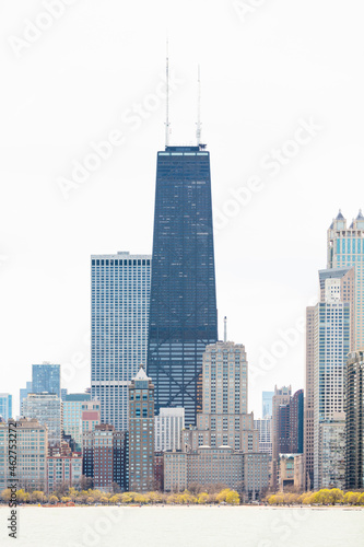 875 North Michigan Avenue (John Hancock Center) surrounded by skyscrapers against clear sky, Chicago, USA photo
