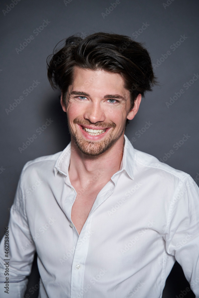 Portrait of smiling handsome man wearing white shirt Portrait of smiling handsome man wearing white shirt