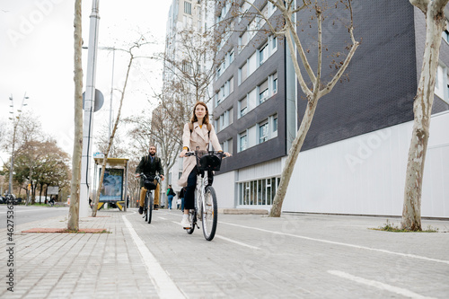 Couple riding e-bikes in the city