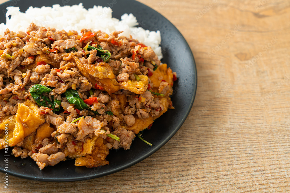 stir-fried minced pork with basil and egg topped on rice stir-fried minced pork with basil and egg topped on rice