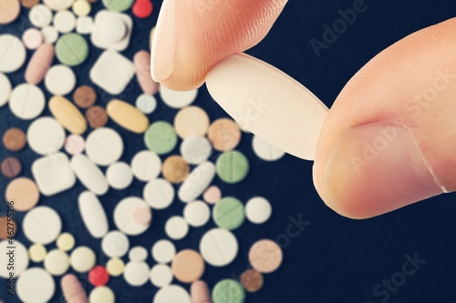 Collection of pill medication on table medical concept photo