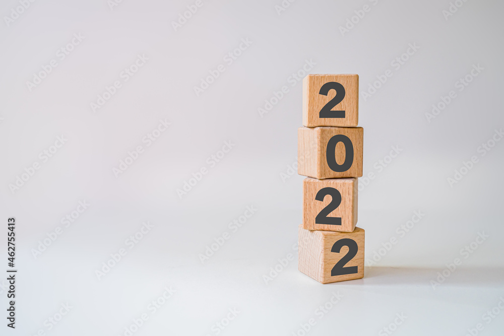 Abstract 2022 design concept - geometric wood blocks cubes on white background. New Beginning. copy space Abstract 2022 design concept - geometric wood blocks cubes on white background. New Beginning. copy space