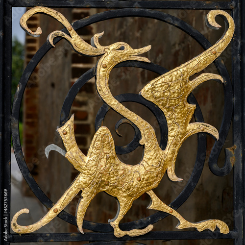 Gilded bas-reliefs of fabulous bird on the gate grating of the medieval Kazan Kremlin, Russia